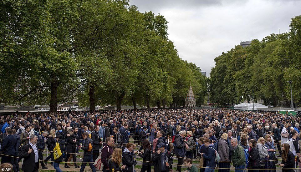 People queue to pay their respect to the late Queen Elizabeth II during the lying-in-state at Westminster Hall in London today