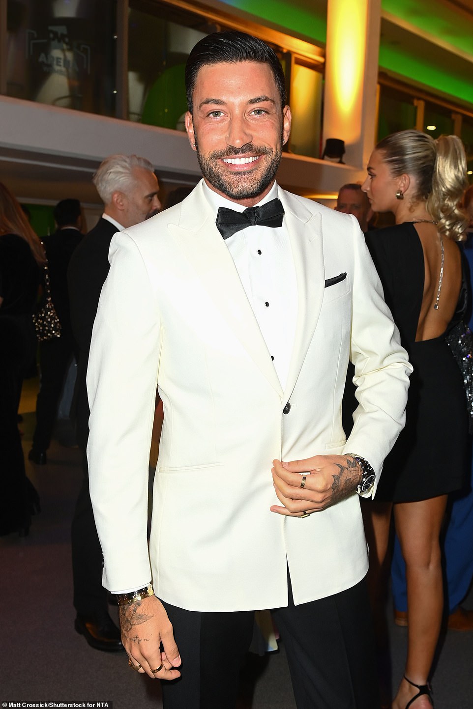 Handsome: Rose's former pro partner Giovanni Pernice scrubbed up well in a white tuxedo