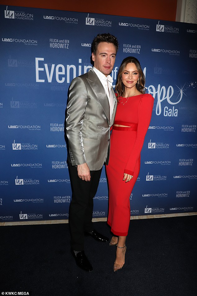 Katharine's look: McPhee stepped out wearing an elegant red long-sleeved dress with a small cutout exposing her toned midriff