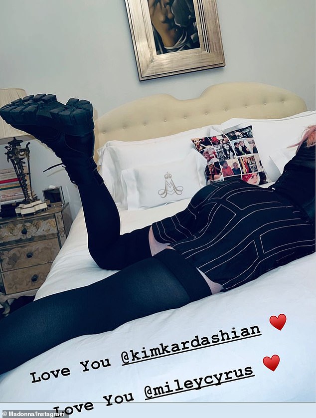 Making amends: Madonna also shared a snap of her shapely bottom and legs as she penned: 'Love you @kimkardashian. Love you @mileycyrus'