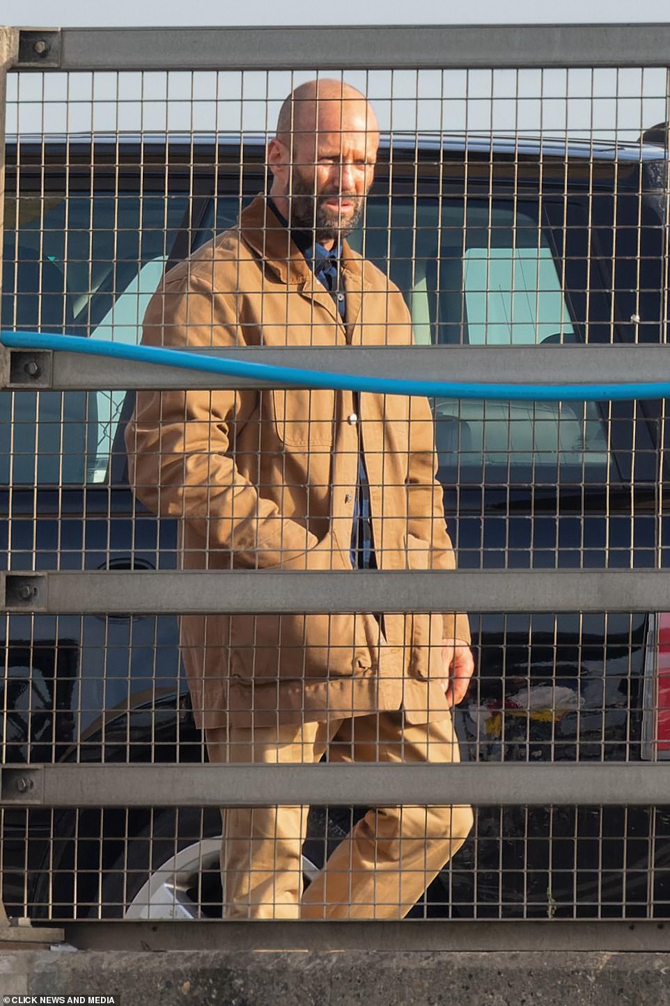 PICTURE EXCLUSIVE FIRST LOOK: Jason Statham wore a brown jacket and trouser co-ord as he shut down a bridge in Kent to shoot dramatic a chase sequence for his new film The Beekeeper on Saturday