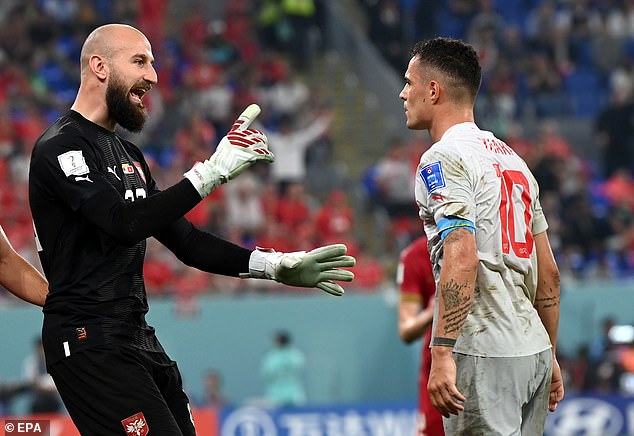 Arsenal midfielder Xhaka exchanges words with Serbia keeper Milinkovic-Savic