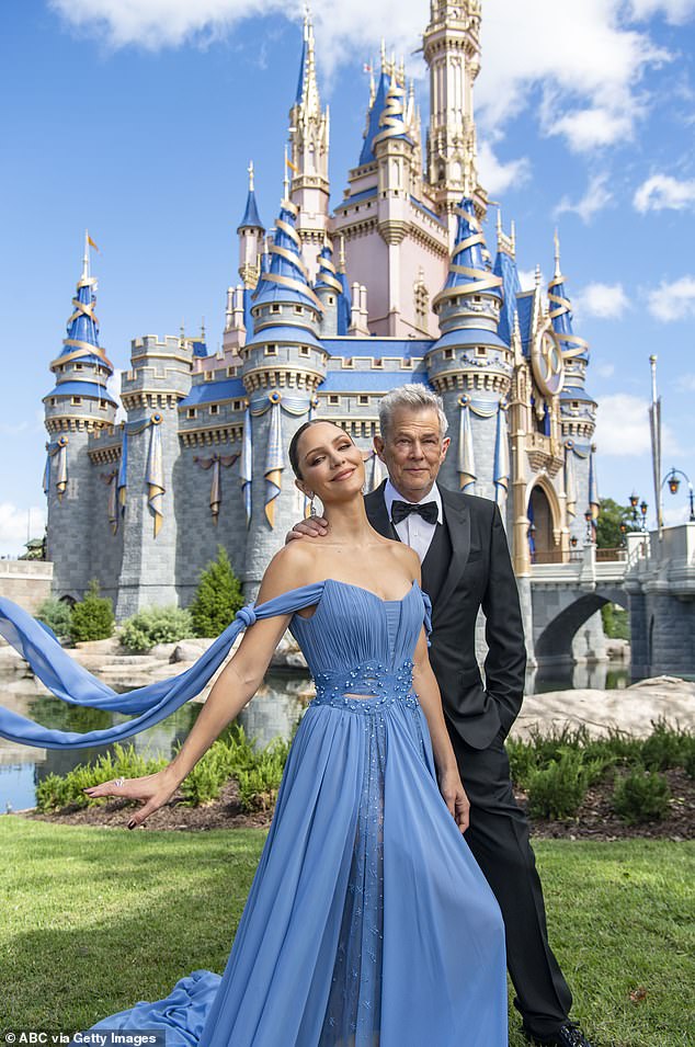 Suited: Katharine and David, who have collaborated on a new Christmas album together, are pictured recently posing up for Disney at the happiest place on earth