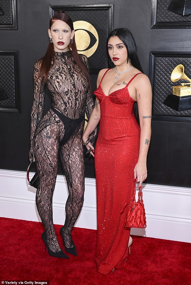 Two's company: The 26-year-old model seemed in good spirits as she walked the carpet with her friend Trinity, who also goes by the name of Eartheater