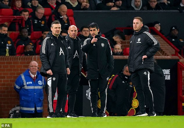 Chris Armas (second left) with Leeds interim boss Michael Skubala (left) at Old Trafford