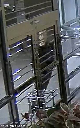 CCTV footage from a second camera inside the lobby shows Lee stumbling towards the entrance of the building before falling over