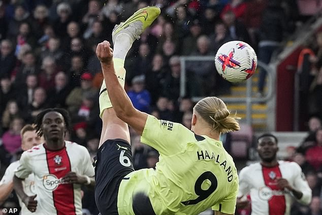 The Norwegian striker normally has his long blond locks tied back in a tight ponytail (above)