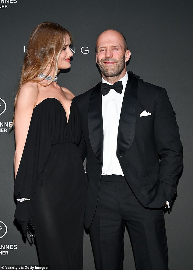 Loved-up: The couple appeared in great spirits as they giggled together and smiled while posing up a storm for the cameras