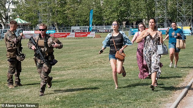 Witnesses of the horrific knife attack are seen running away from the scene in Annecy on Thursday 9 June