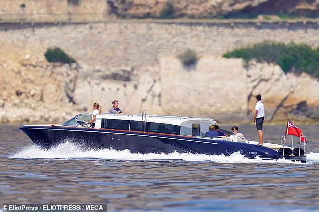 Bezos and Sanchez opted to sit inside the boat, hidden from the blazing sun