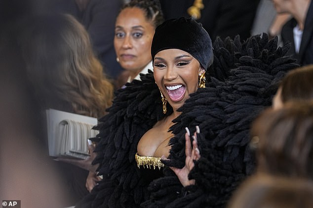 Ouch: Cardi's fashion week appearance comes after it was reported that she and her husband Offset 'will hash their problems out as they always do' according to a new report - after he claimed she cheated on him - sparking a furious row