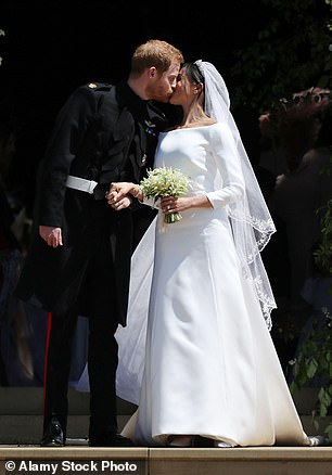 Prince Harry and Meghan Markle kiss on the steps of St George's Chapel in Windsor Castle after their wedding