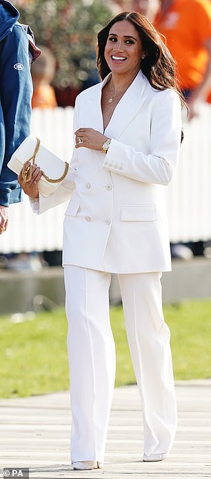 Style doppelgangers: Meghan arriving for a reception, hosted by the City of The Hague and the Dutch Ministry of Defence, celebrating the forthcoming Invictus Games, wearing a white suit