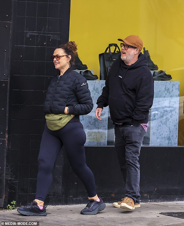 The happy couple were matching in their casual all-black outfits