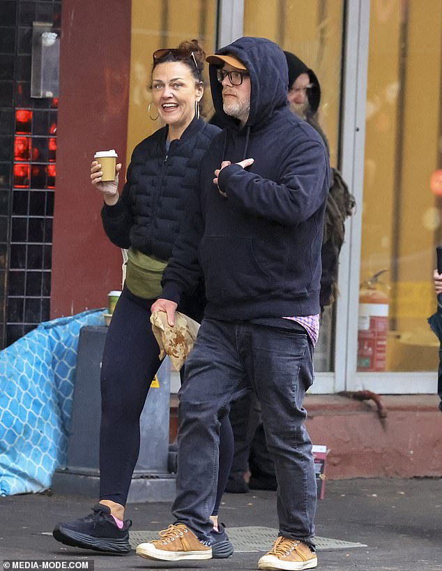 Chrissie's beau also kept it casual as he wore a pair of black jeans, a black hoodie, a pair of brown trainers a brown baseball cap