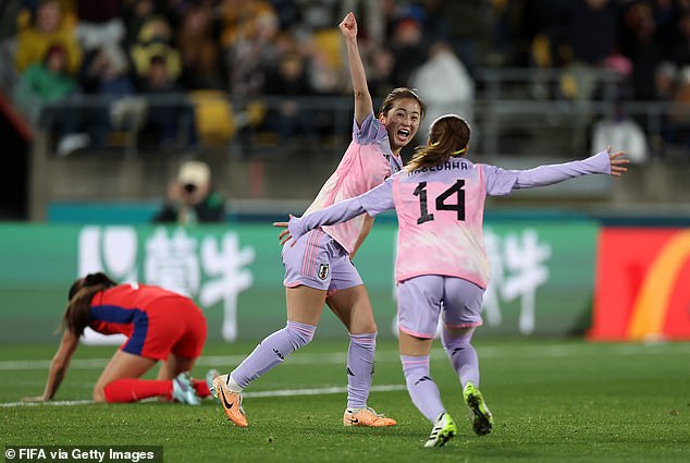 It was Shimizu (middle) goal at the tournament, and she wheeled away to celebrate with Yui Hasagawa (right) after scoring