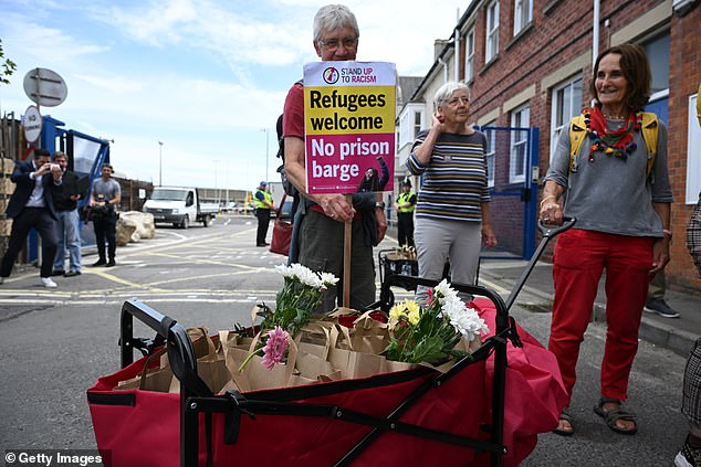 The group were not able to give these directly to the migrants and had to leave them with security staff at the port gate