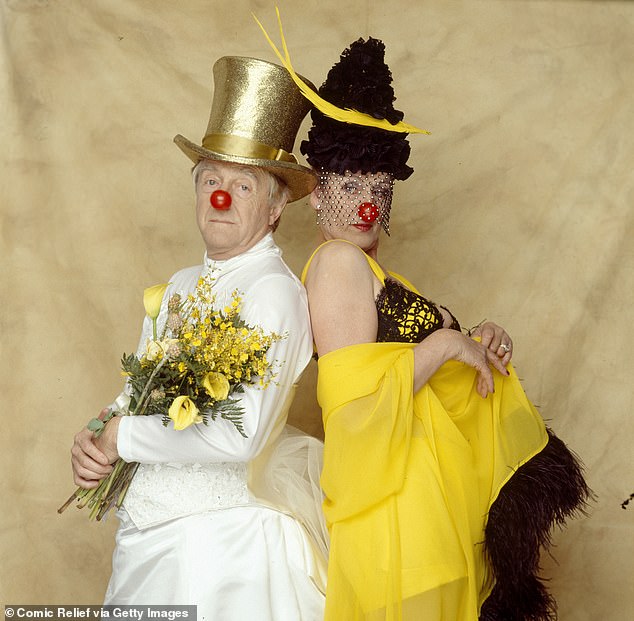 Michael Parkinson and Germaine Greer pose for a portrait session for Comic Relief's Red Nose Day telethon in 1997