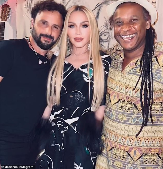 Strike a pose: Madonna shared this image with two of her musician pals