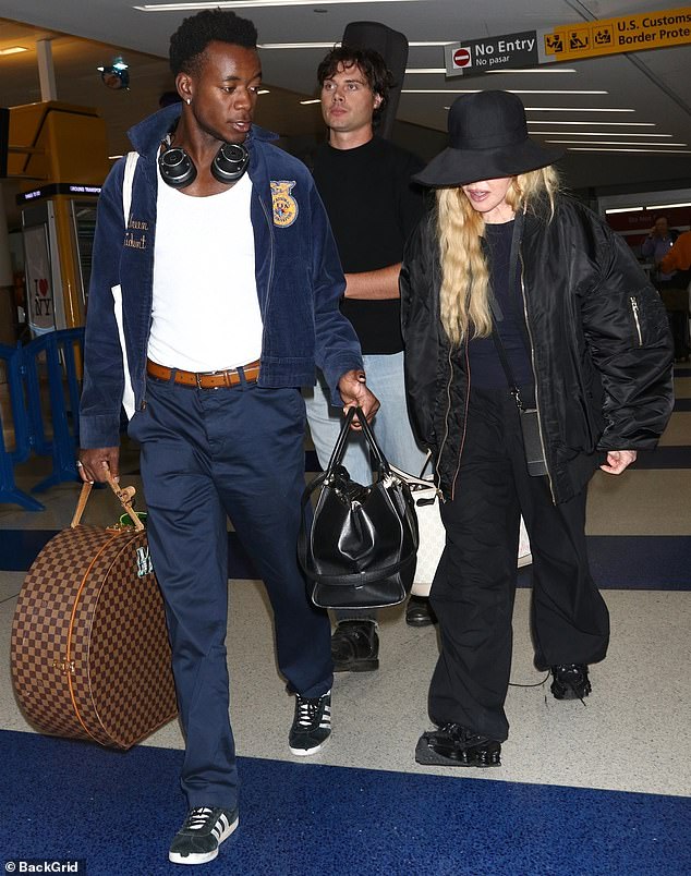 Standing out: The hitmaker cut a fashionable figure in an all-black outfit as she strolled through the travel hub after finishing up a flight from Lisbon, where she recently celebrated her 65th birthday