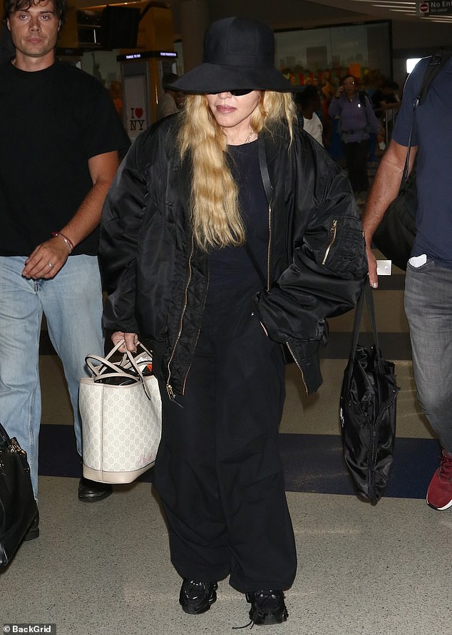 Showing up: Madonna was seen while arriving at JFK Airport in New York City on Tuesday