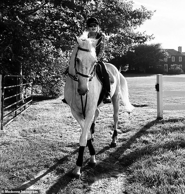 Heading out: She also included a black-and-white photo of herself riding a horse during a trip to an estate