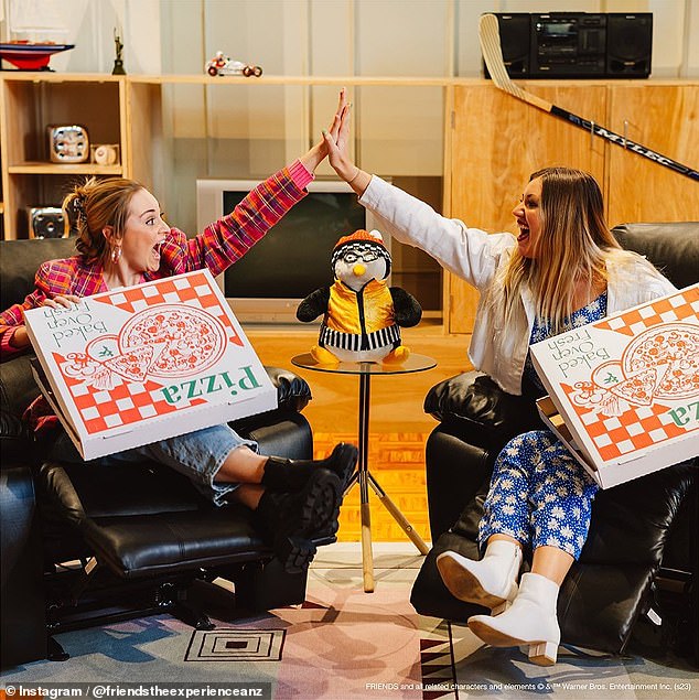 Two Friends fans are seen hanging out in Chandler and Joey's apartment