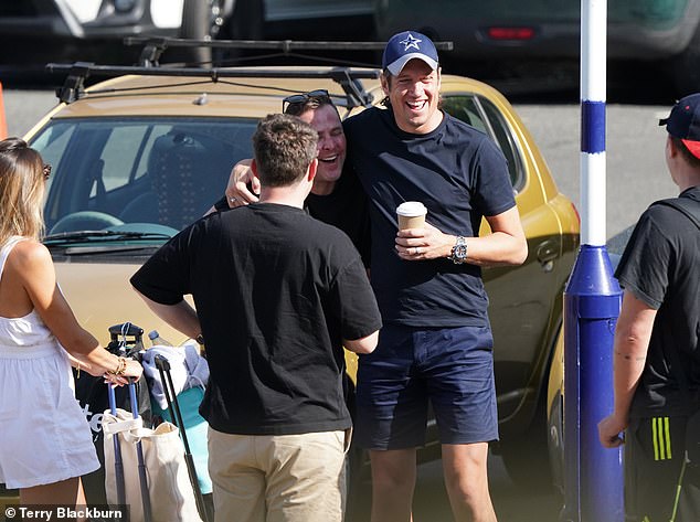 Off we go: Vernon Kay, Chris Stark, Scott Mills and Roman Kemp led the celebrity revellers catching a train back from the wedding of the summer