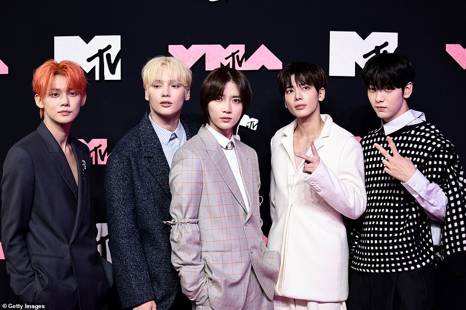 Smolder: (L-R) Yeonjun, HueningKai, Beomgyu, Taehyun and Soobin of Tomorrow X Together on the red carpet