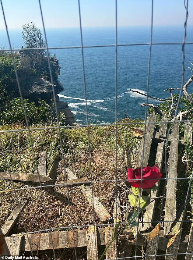 A mourner has left a rose at the scene of the crash site on Thursday