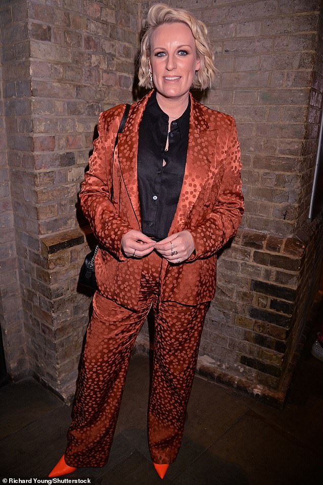 Chic: Steph McGovern looked lovely in an orange silk suit