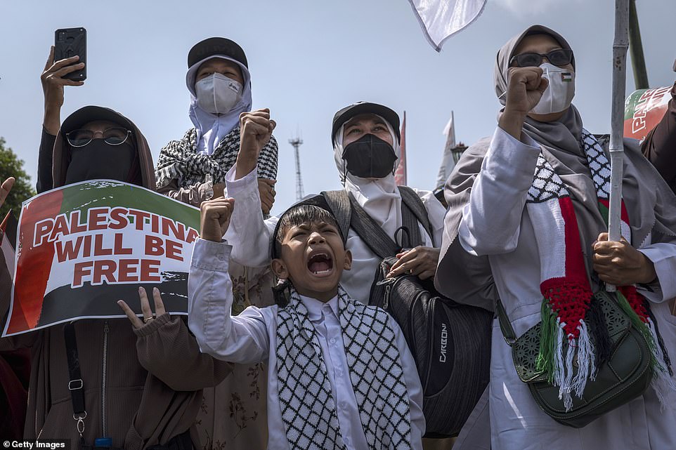 INDONESIA: Indonesian Muslims react as they gather during a rally in support of Palestine after Friday prayers in Yogyakarta