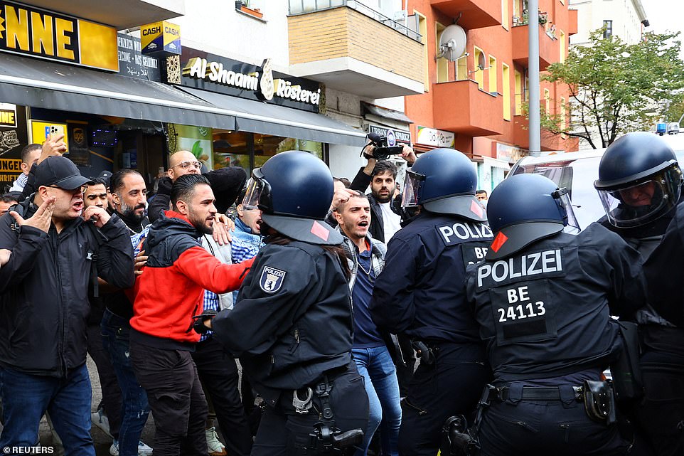 GERMANY: People argue with police officers at a Pro-Palestinian protest during the ongoing conflict between Israel and Hamas on Friday in Berlin