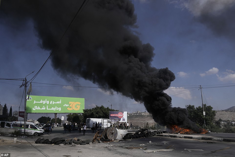 WEST BANK: Palestinian demonstrators clash with Israeli forces following a demonstration in support of the Gaza Strip, in the West Bank city of Nablus on Friday