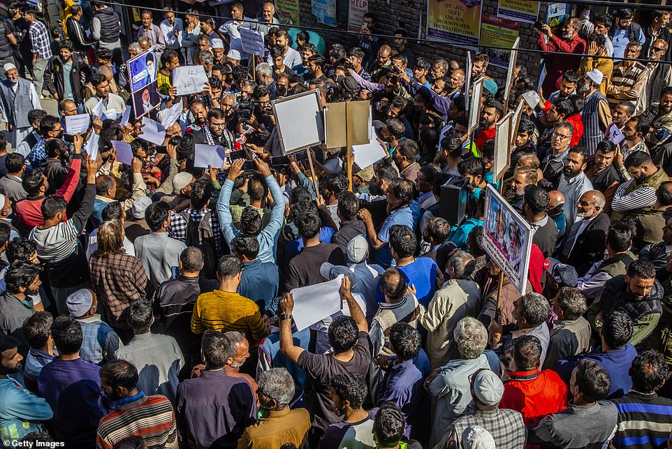 INDIA: Kashmiri Muslims hold placards as they chant slogans against Israel and the U.S. during a protest against Israel's military operations in Gaza, on Friday