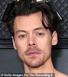 As he was: Harry's fans went into meltdown amid claims he has shaved off his famous locks (pictured in February)