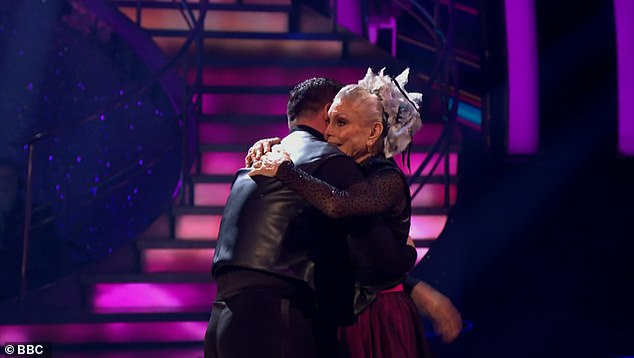 Made it through: After both couples took to the floor for a second time judges Craig Revel Horwood , Motsi Mabuse and Anton Du Beke all opted to save Angela