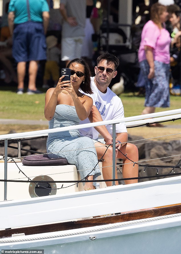 Brooke flaunted her toned figure during the romantic trip, pouring her frame into a strapless blue dress