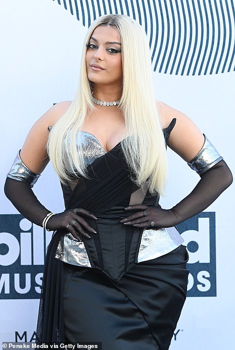 Bombshell: The I'm Good singer accessorized with mesh black and silver gloves, and wore her light blonde tresses in a straight style