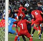 Harry Souttar (right) heads the Socceroos into the lead against Palestine. Picture: Yasser Al-Zayyat / AFP