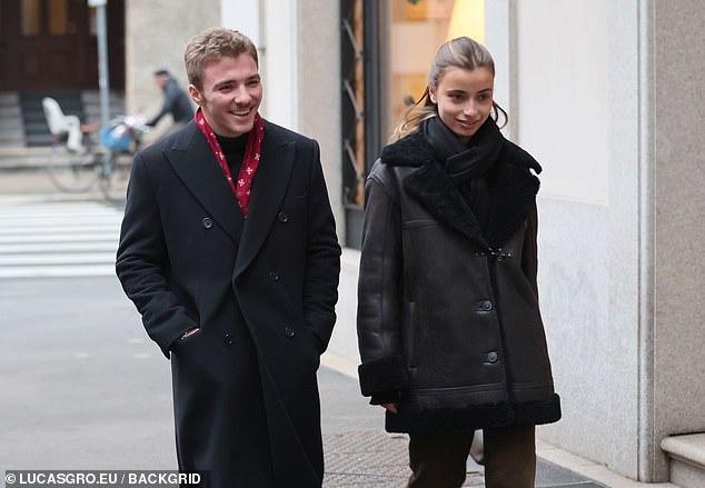 Rocco Ritchie, 22, couldn't wipe the smile off his face as he stepped out with his new mystery girlfriend Olivia Monjardin in Milan on Monday