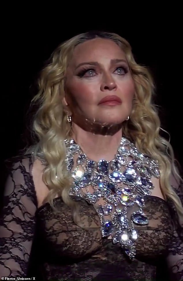 Sad: Madonna got emotional on the latest stop of her highly-anticipated The Celebration Tour in Amsterdam on Friday, which coincided with the anniversary of her mother's death and World AIDS Day