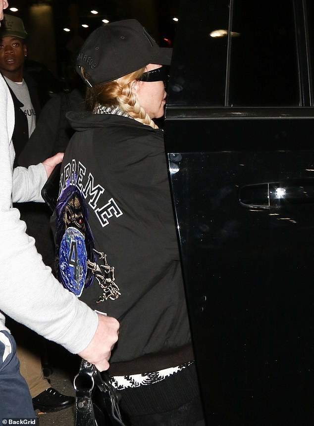 Eventually, Madonna  and the rest of the group got into the SUV and were driven to their sprawling Manhattan home