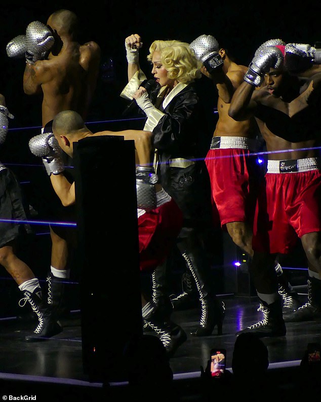 Boxers behind her rocked red velvet shorts