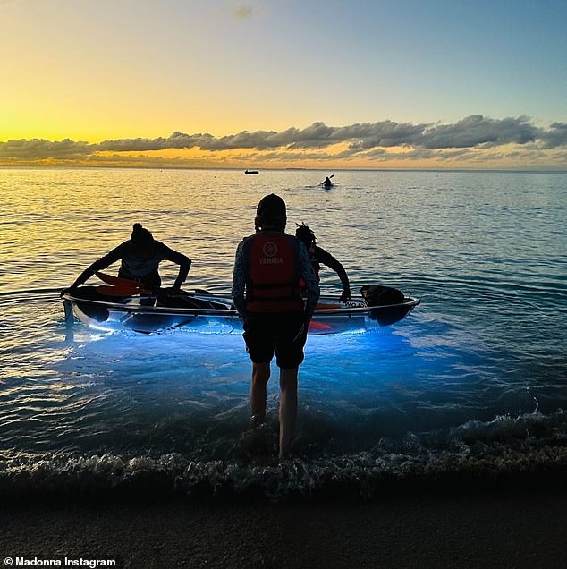 Madonna was snapped wading out to sea as the sun set in the stunning beachside snaps