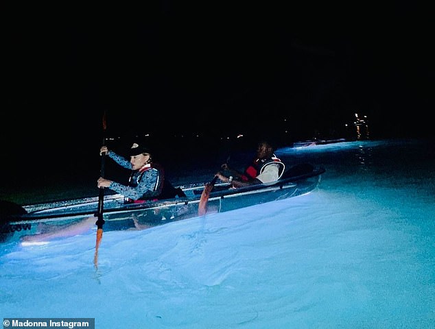 The kayaks lit up in different colours on their bases and were seen glowing in the sea as Madonna headed off for the nighttime trip out