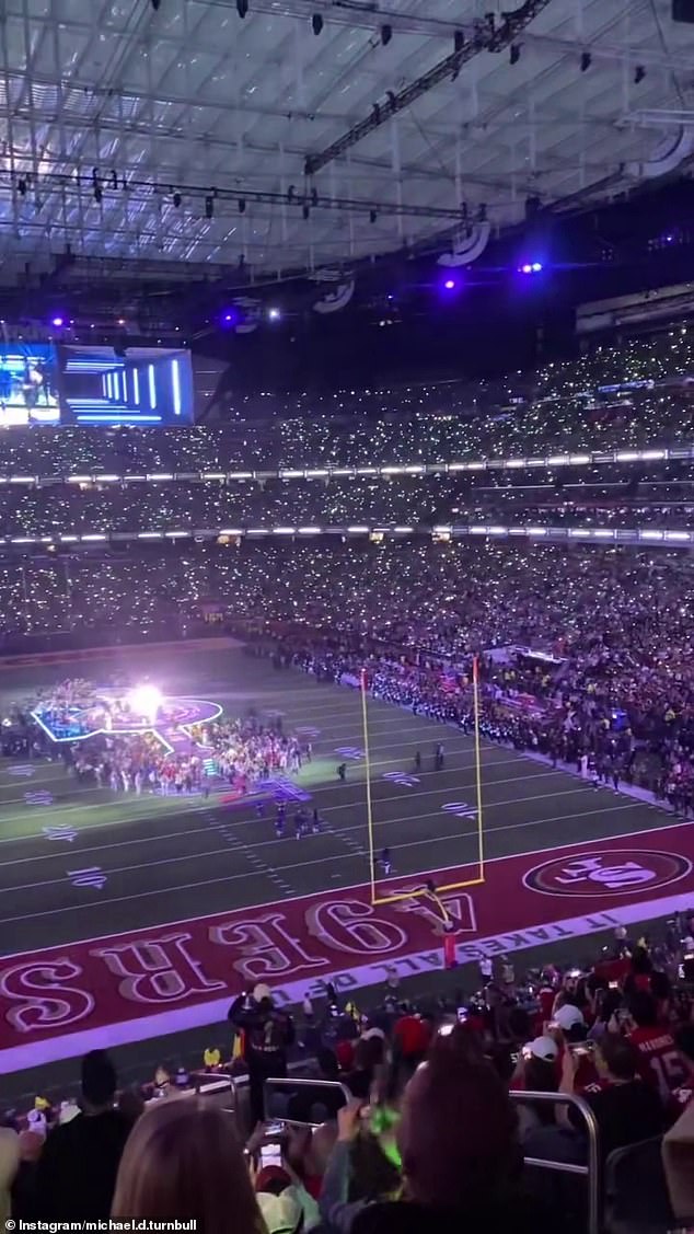 Another shot showed the half time show beginning, but not much detail of the stage could be seen because Michael's seats were so far up in the stands