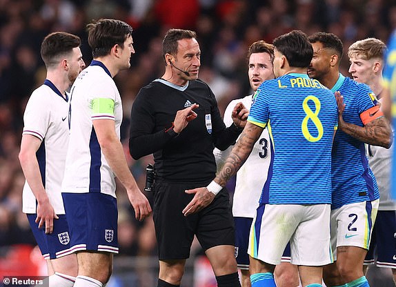 Soccer Football - International Friendly - England v Brazil - Wembley Stadium, London, Britain - March 23, 2024 Brazil's Lucas Paqueta appeals to referee Artur Soares Dias REUTERS/Carl Recine