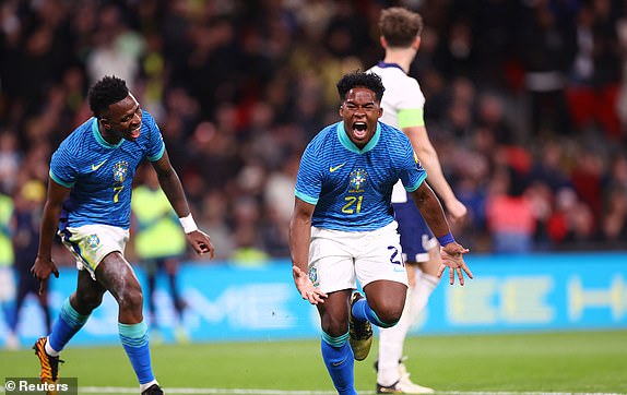 Soccer Football - International Friendly - England v Brazil - Wembley Stadium, London, Britain - March 23, 2024 Brazil's Endrick celebrates scoring their first goal with Vinicius Junior REUTERS/Carl Recine