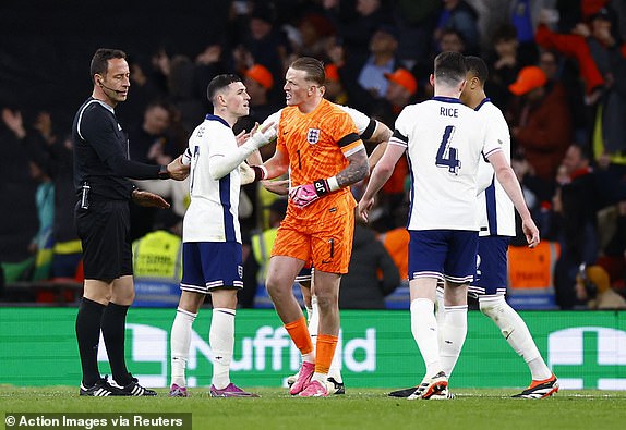 Soccer Football - International Friendly - England v Brazil - Wembley Stadium, London, Britain - March 23, 2024 England's Phil Foden, Jordan Pickford and teammates react after Endrick scored Brazil's first goal Action Images via Reuters/Peter Cziborra